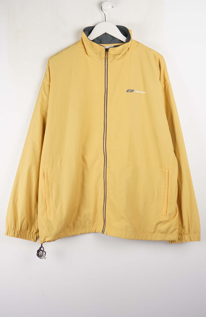 Yellow jacket with a brand logo on a white background