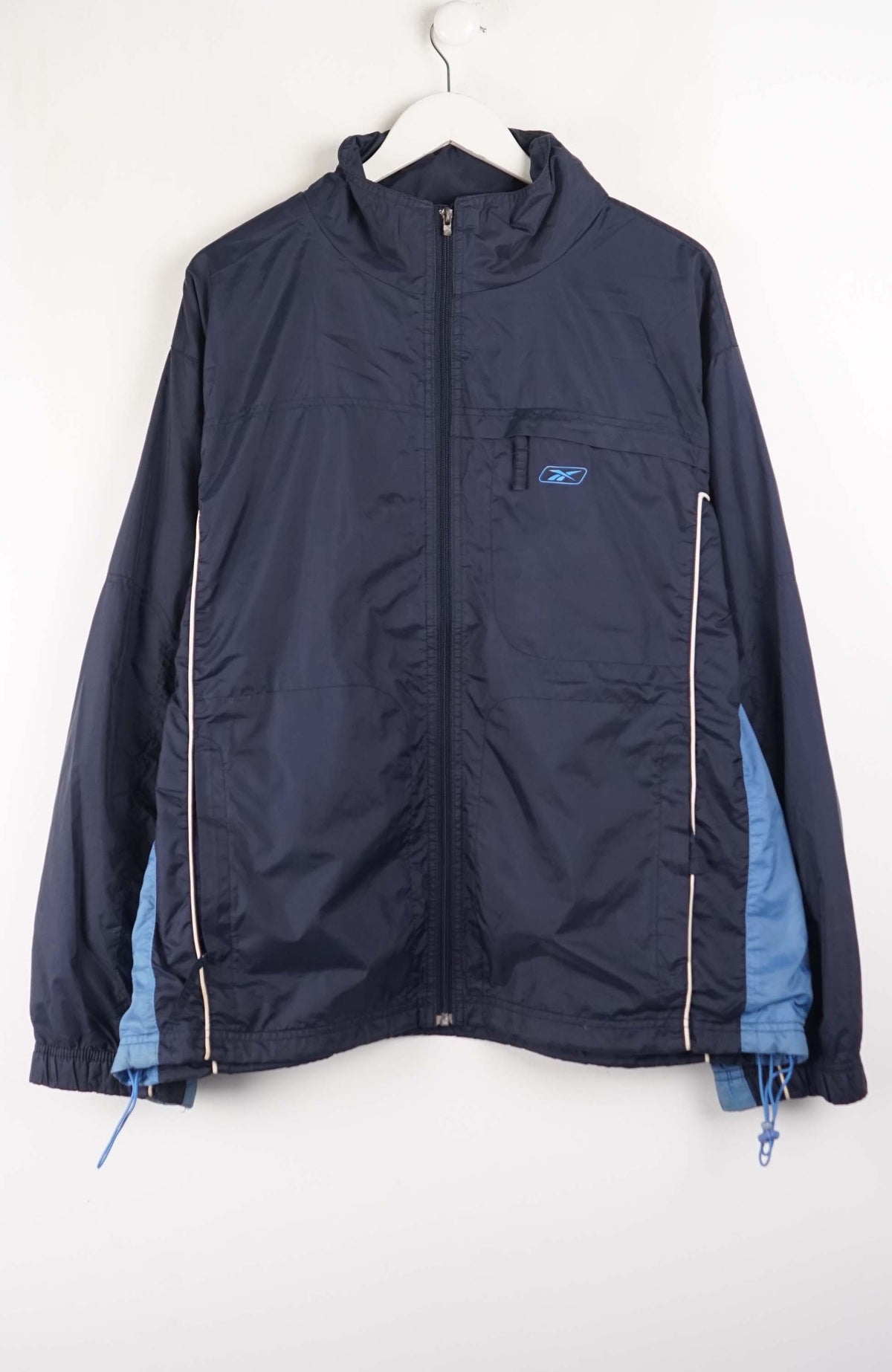 Navy jacket with blue lining on a white hanger