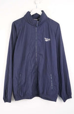 Navy blue jacket with Reebok logo on a white background