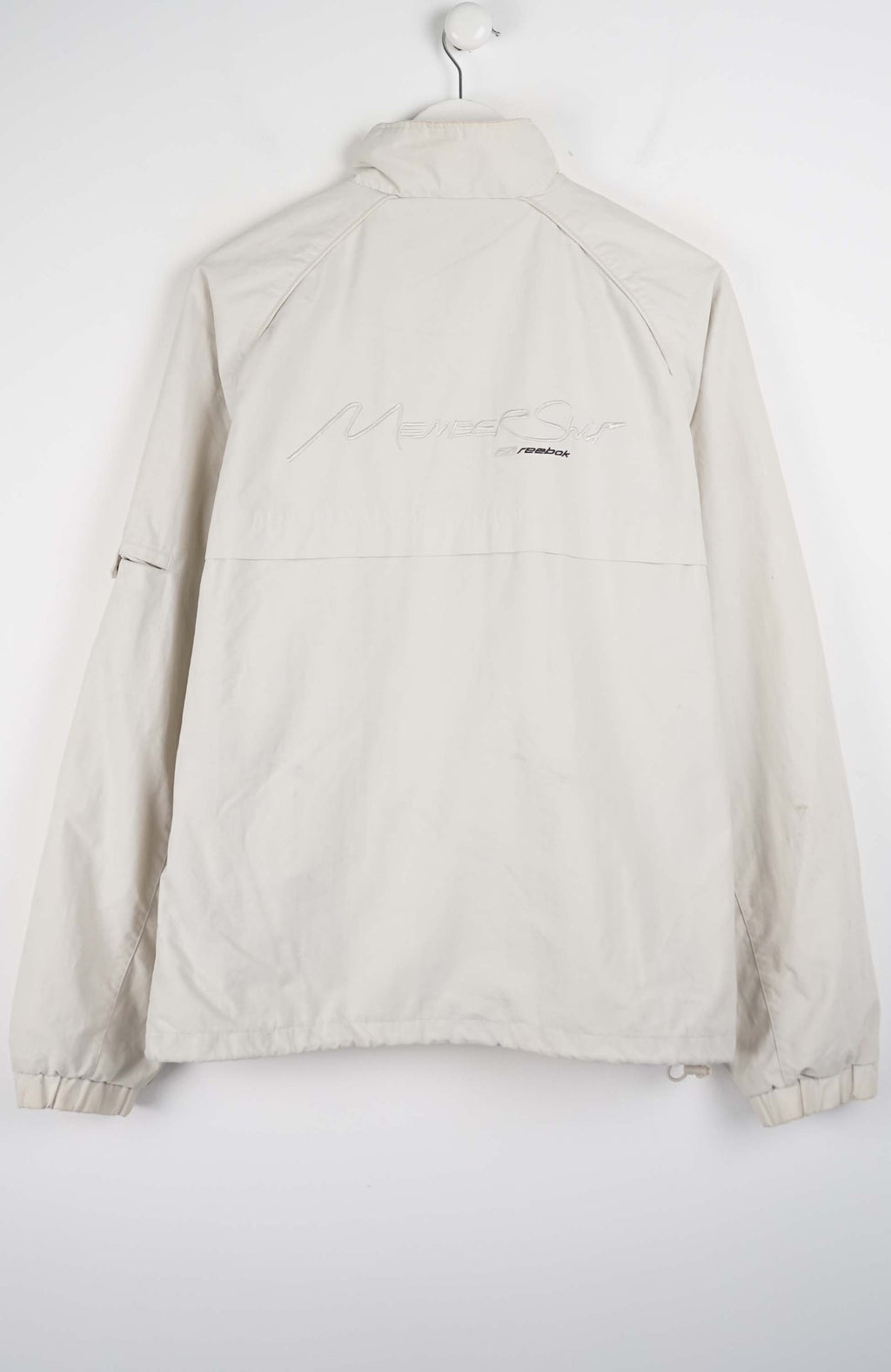 Beige jacket with a brand logo on a white background