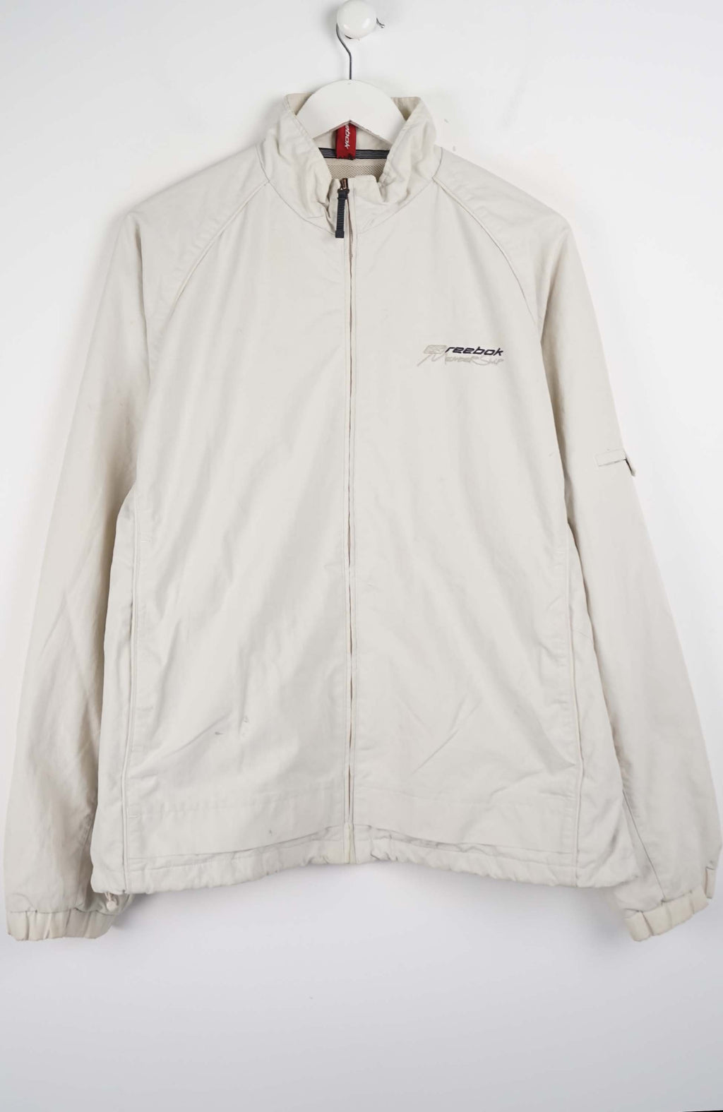 Beige jacket with a brand logo on a white background