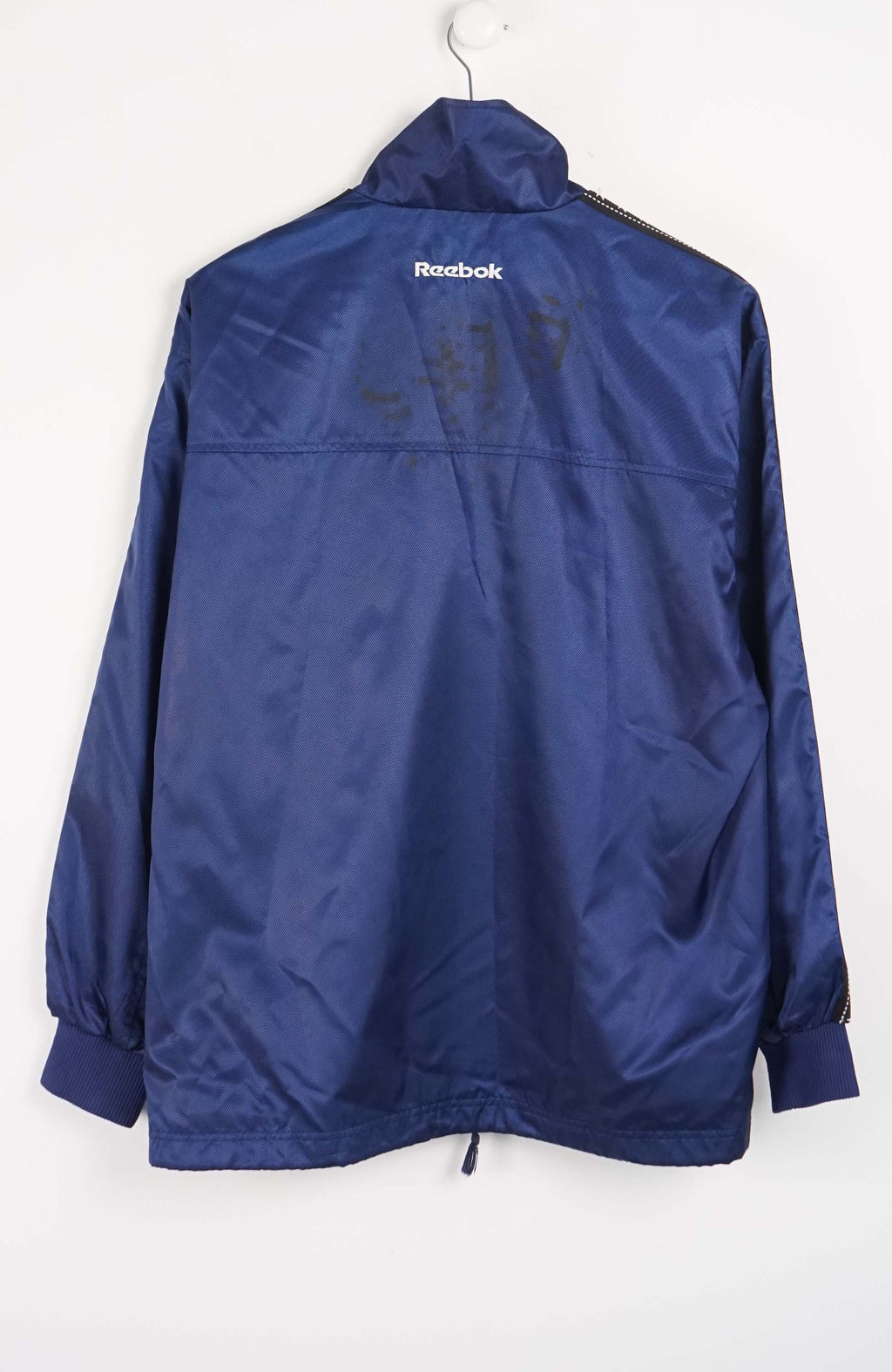 Blue jacket with Reebok logo on a white background
