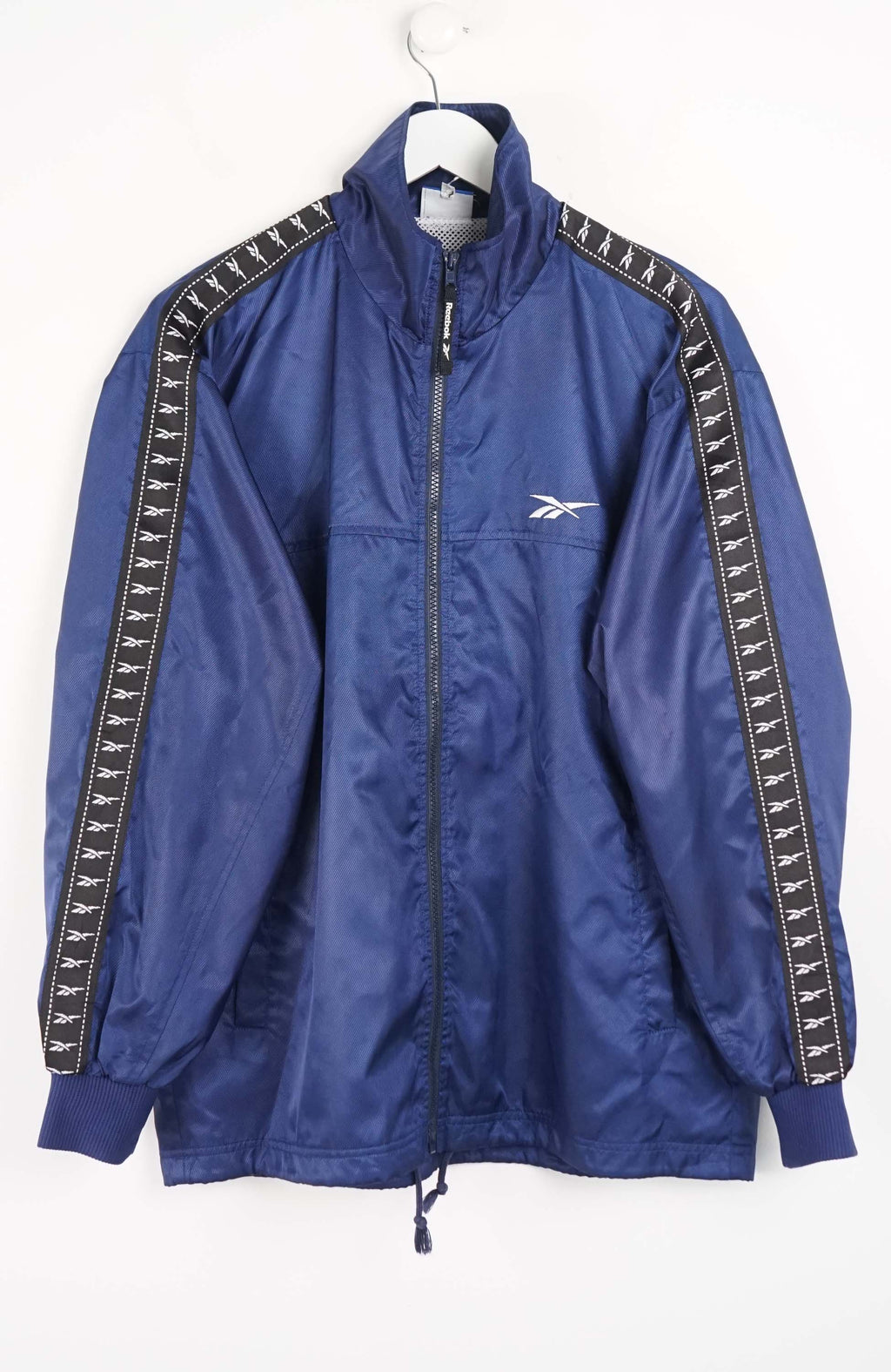 Blue jacket with Reebok logo on a white background