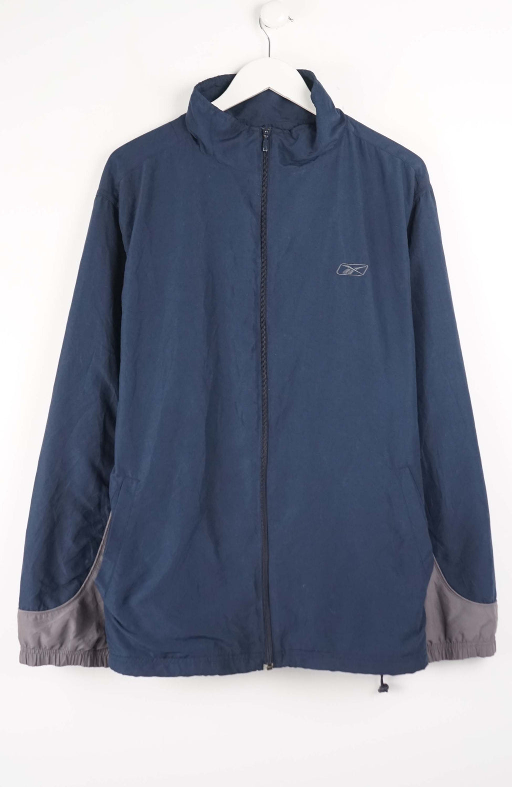 Blue jacket with gray accents on a white hanger