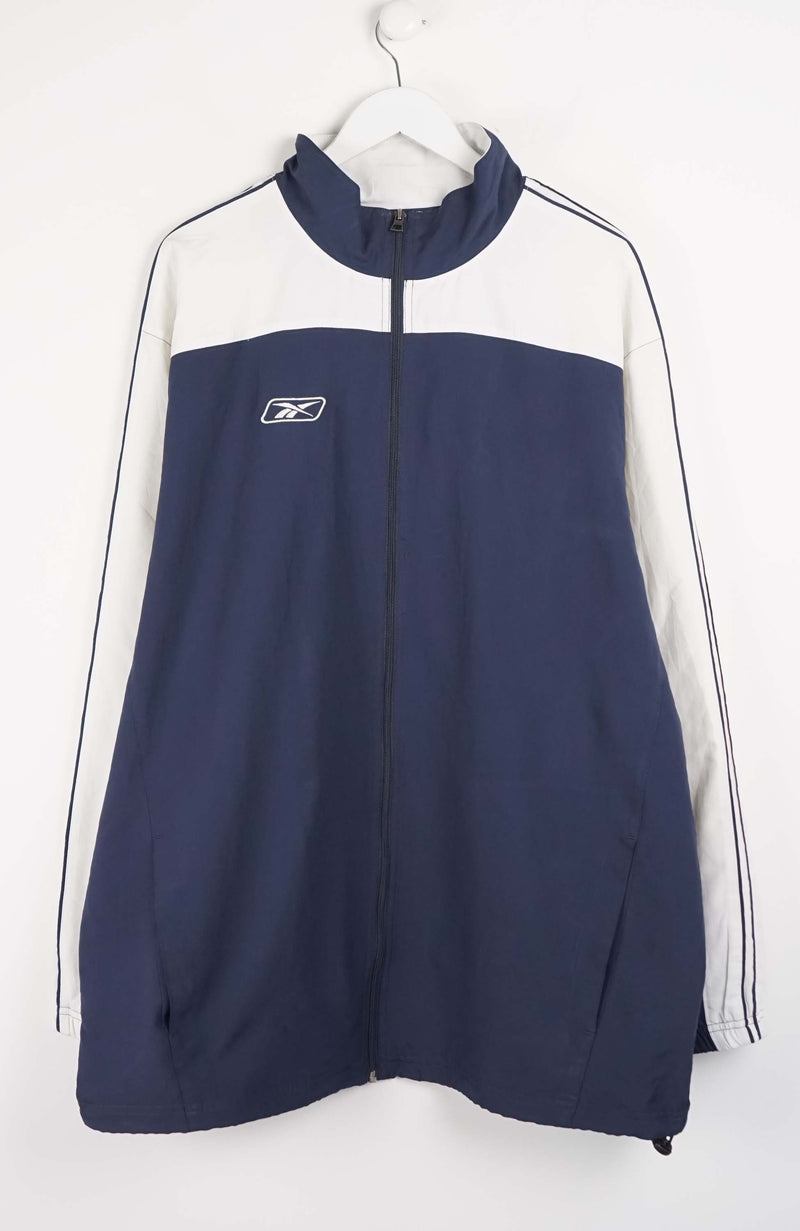 Navy and white tracksuit jacket with a brand logo on a white background