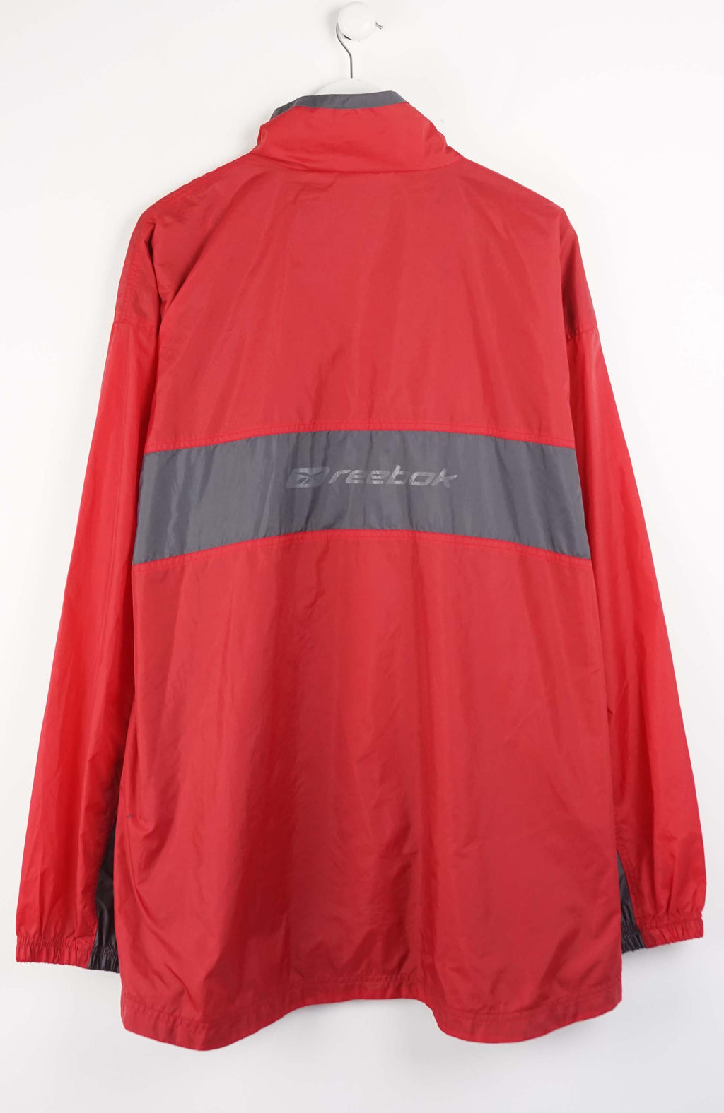 Red jacket with Reebok logo on a white background