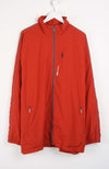 Red jacket with white stripes on sleeves hanging on a white background