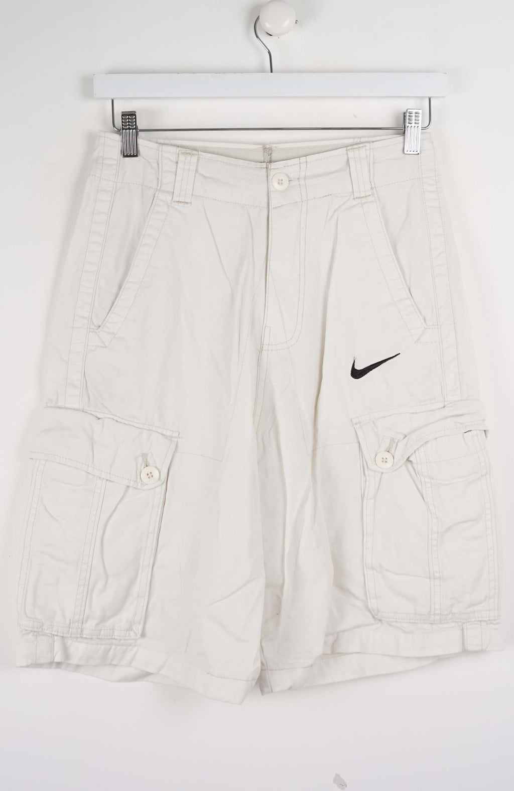 Light gray cargo pants with a Nike logo on a white background