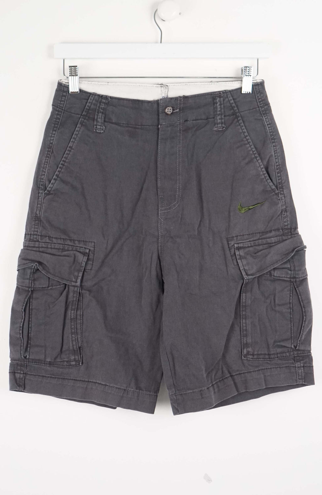 Gray cargo shorts on a white hanger against a white background