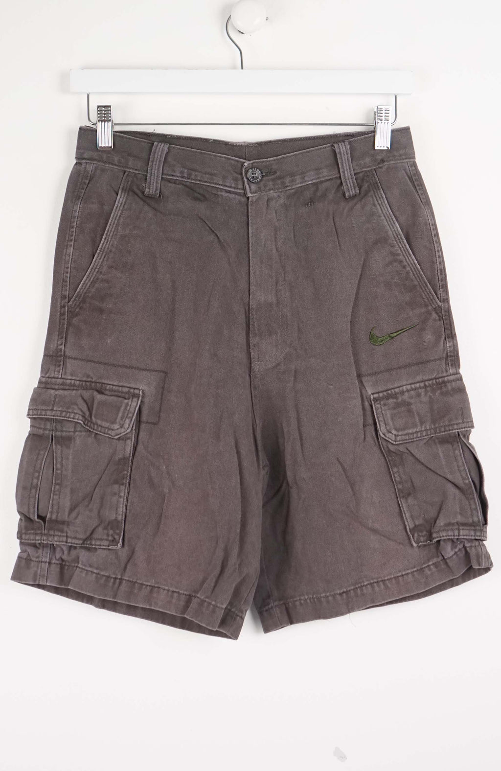 Gray cargo shorts with a Nike logo on a white background