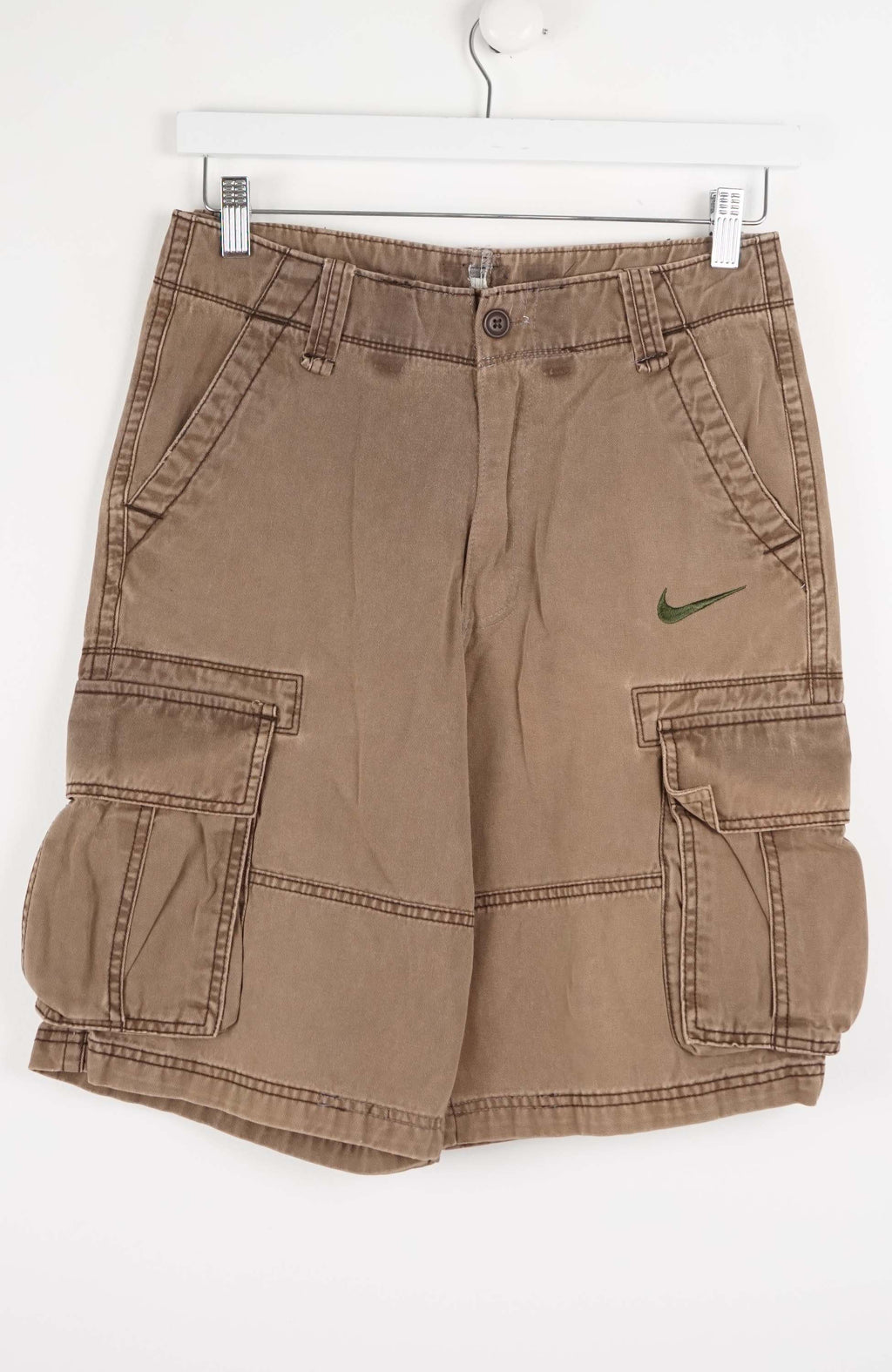 Brown cargo shorts with a Nike logo on a white background