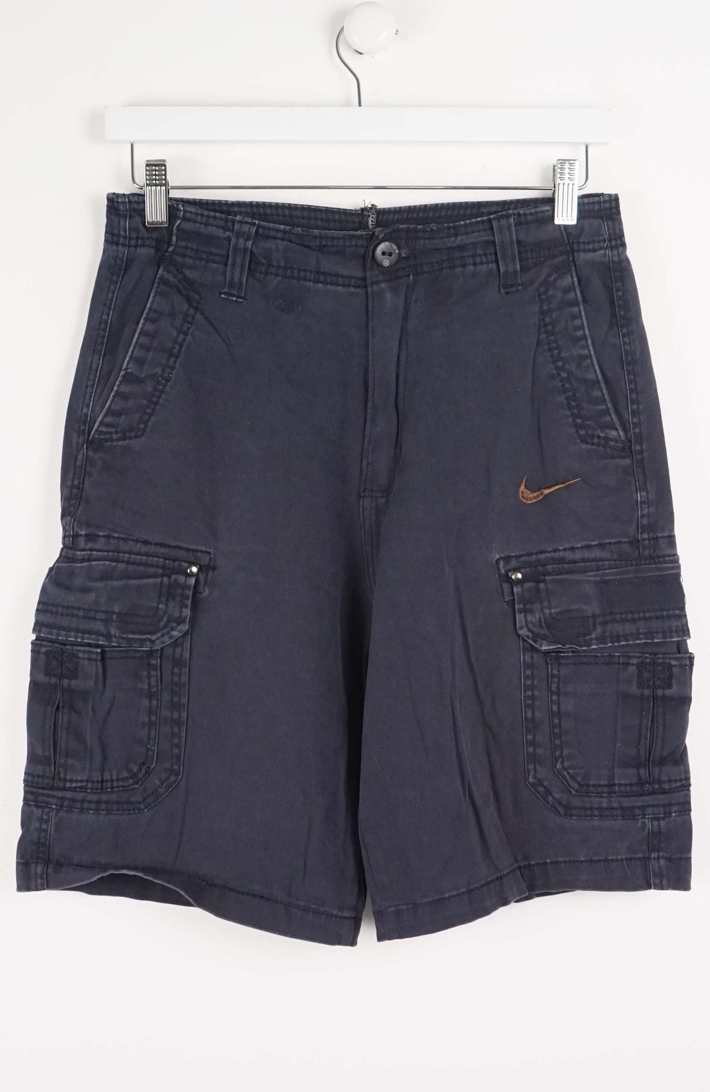 Blue cargo shorts with a Nike logo on a white background
