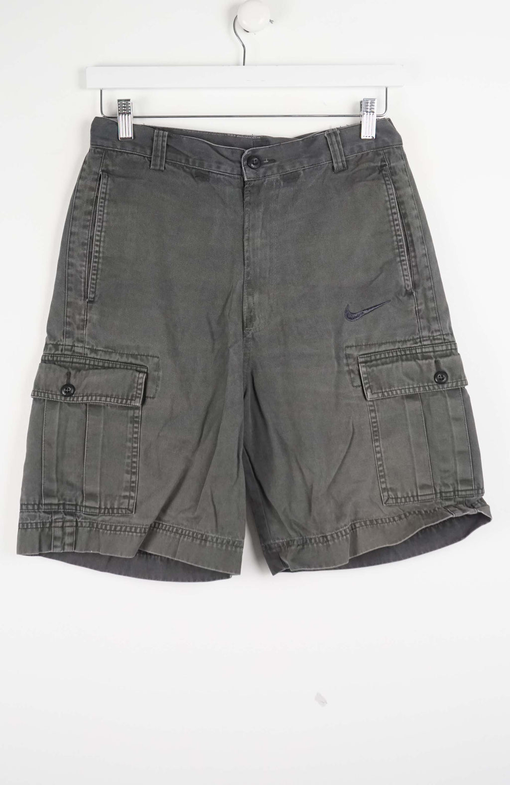 Gray cargo shorts on a white background