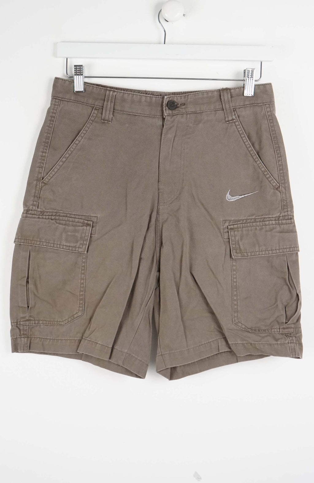Brown cargo shorts with Nike logo on a white background