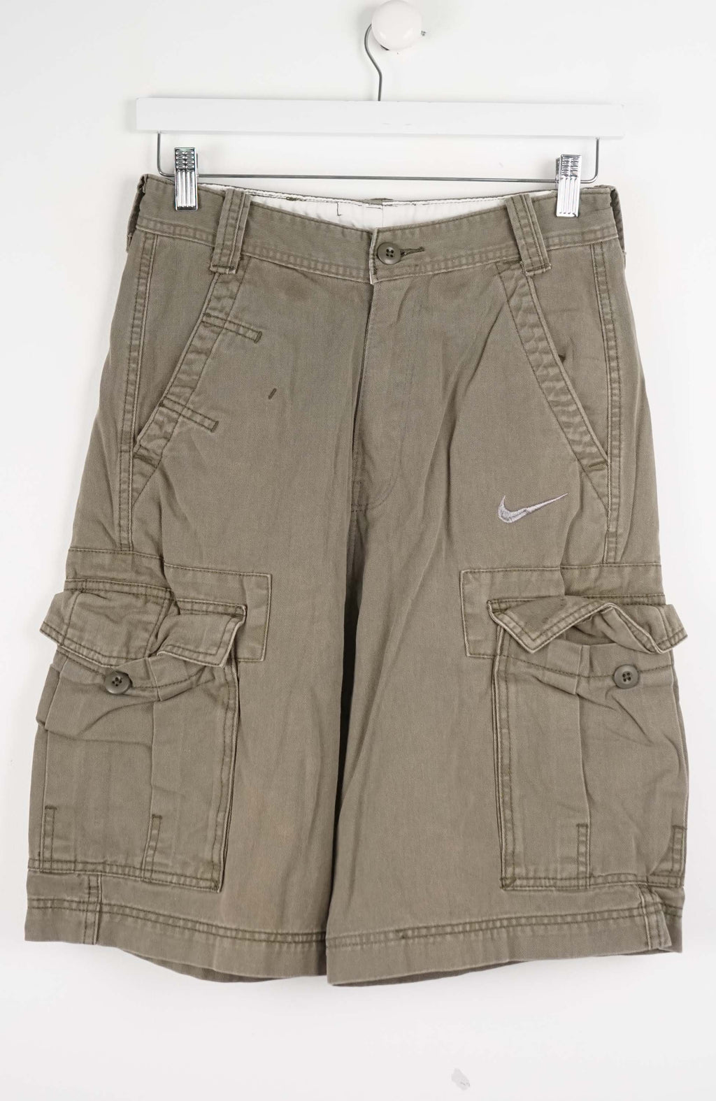 Khaki cargo shorts with a Nike logo on a white background