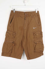 Brown cargo shorts with a Nike logo on a white background