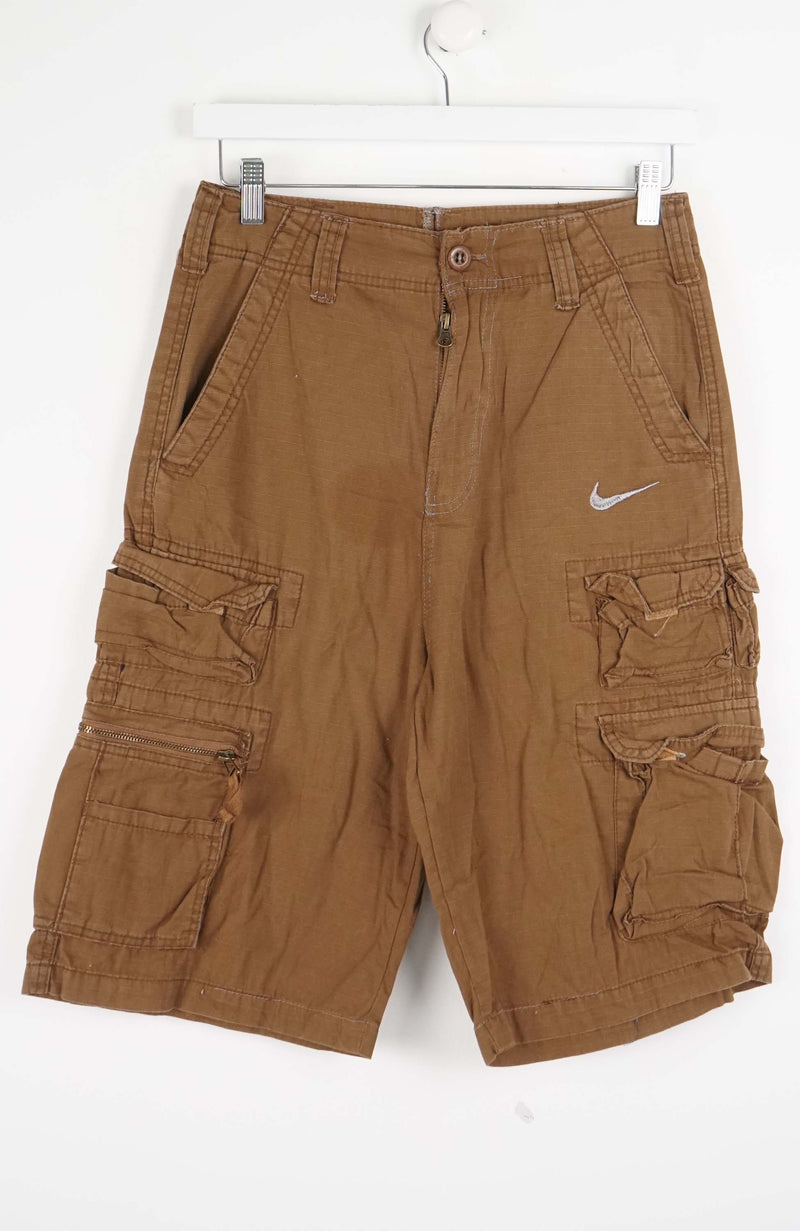 Brown cargo shorts with a Nike logo on a white background