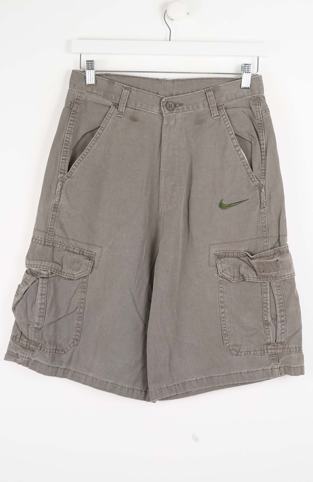 Gray cargo shorts with a Nike logo on a white background