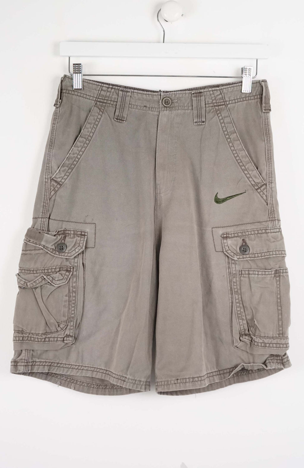 Gray cargo shorts with a Nike logo on a white background