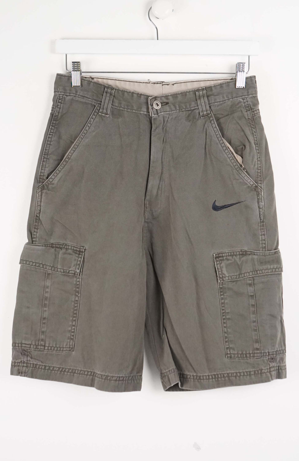 Gray cargo shorts with a Nike logo on a white background