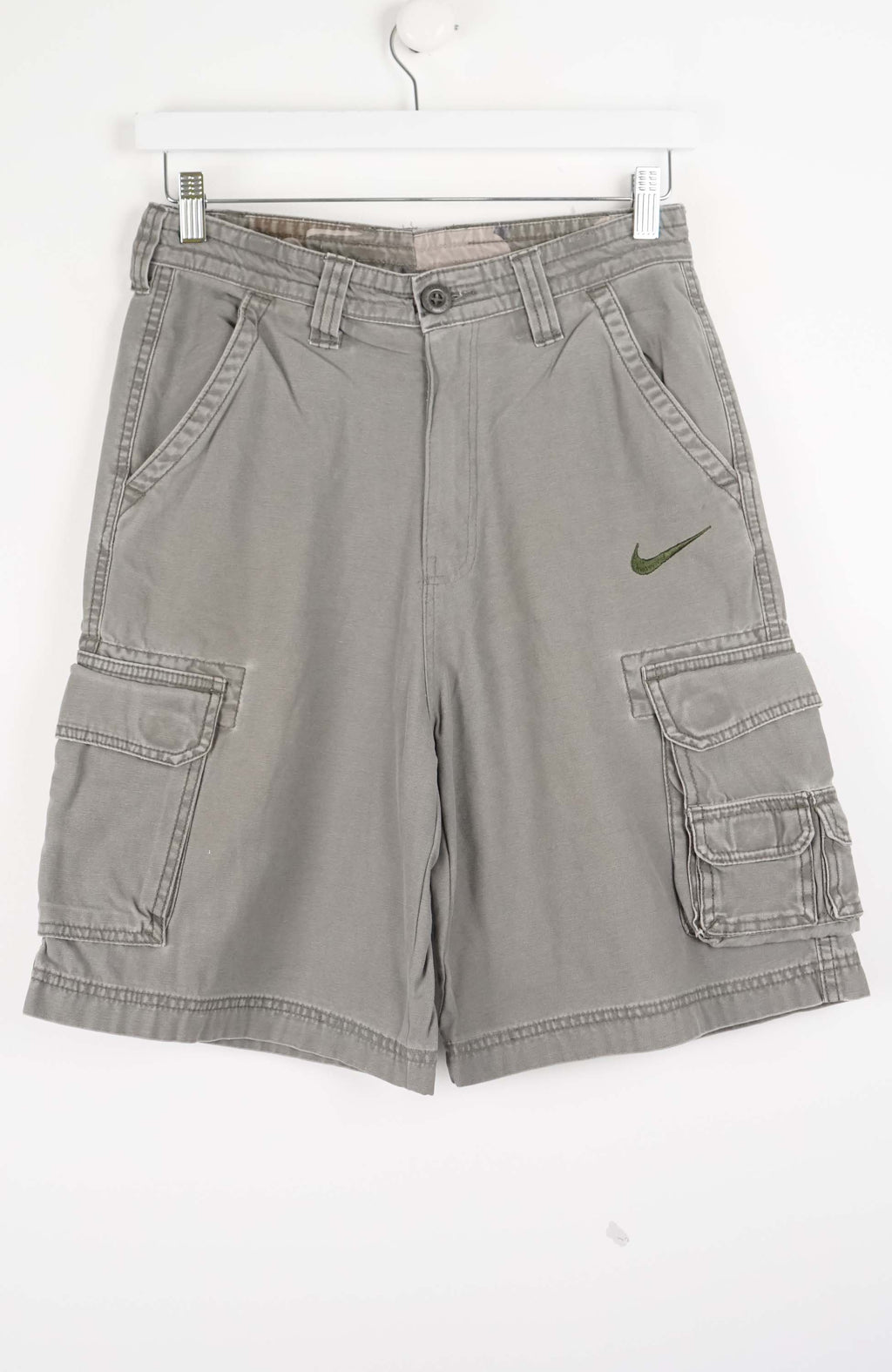 Gray cargo shorts with a Nike logo on a white background