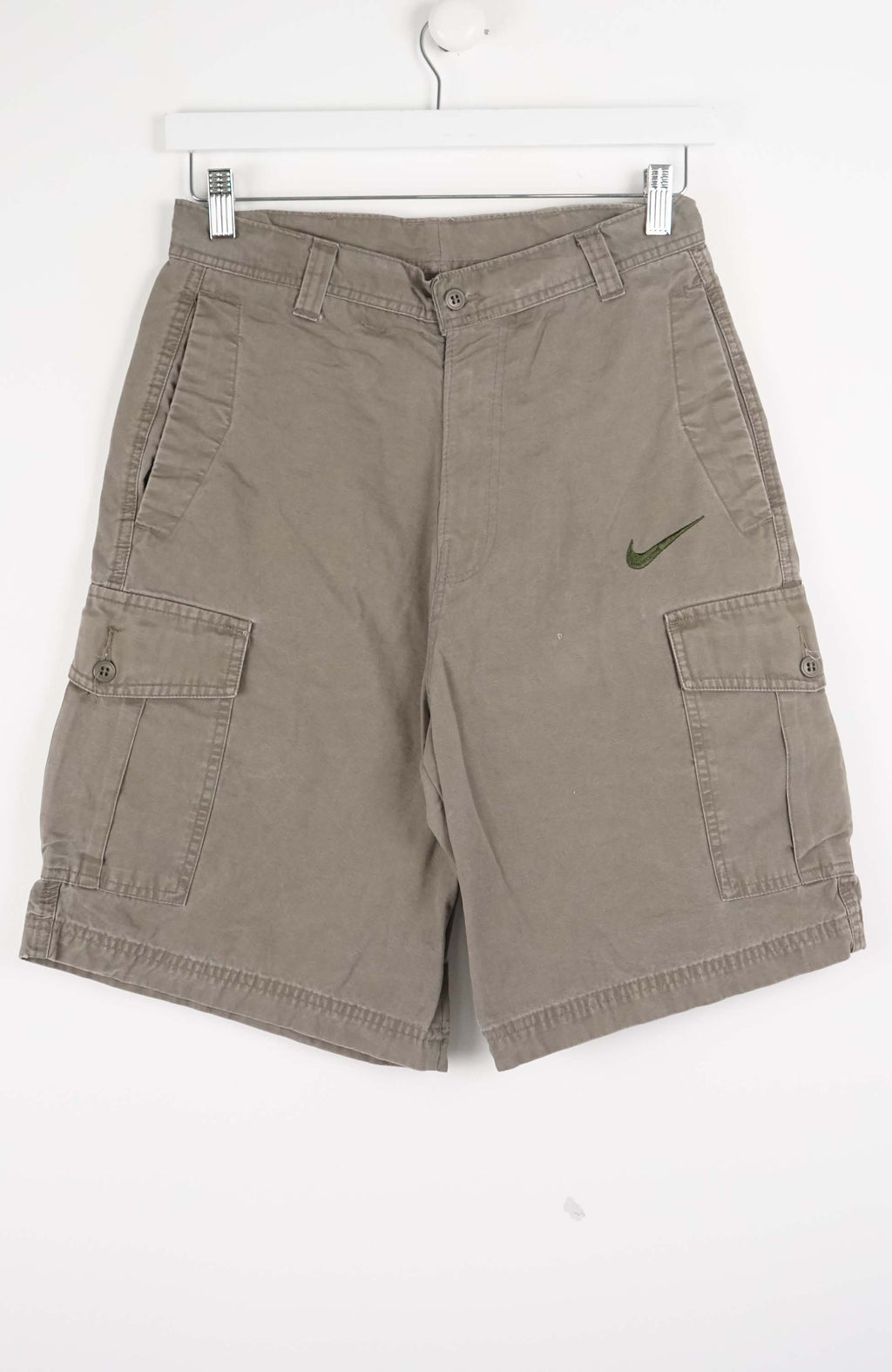Brown cargo shorts with a Nike logo on a white background