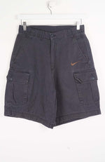 Gray cargo shorts with a Nike logo on a white background