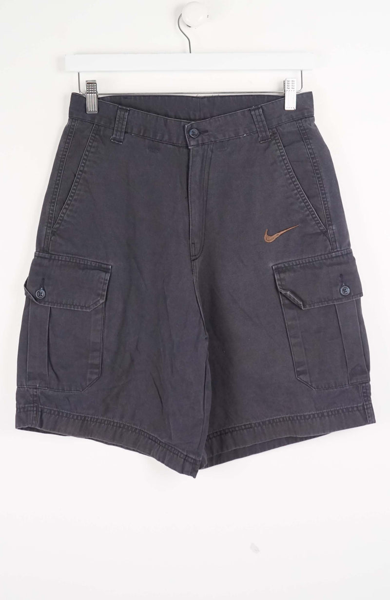 Gray cargo shorts with a Nike logo on a white background