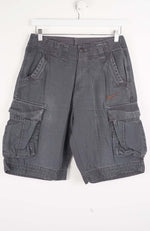 Gray cargo shorts with a Nike logo on a white background