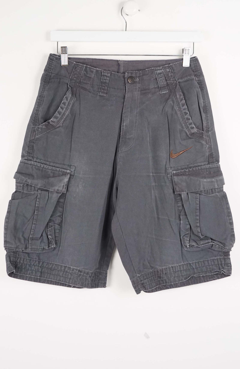 Gray cargo shorts with a Nike logo on a white background