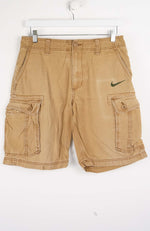 Beige cargo shorts with Nike logo on a white background