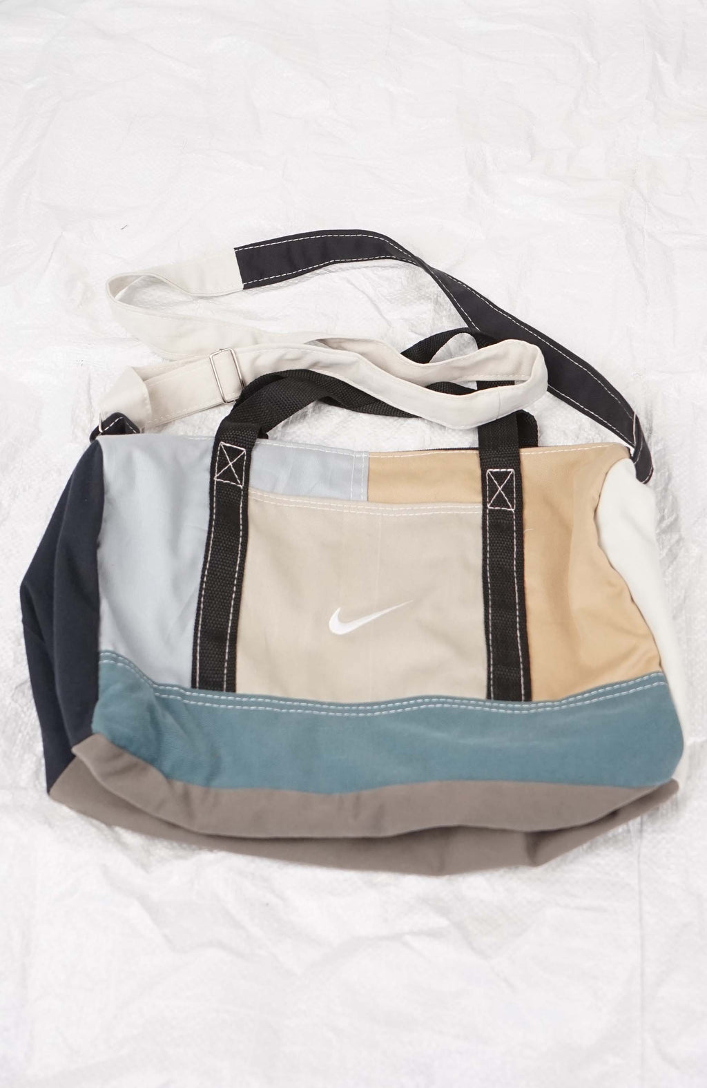 Multicolored bag with Nike logo on a white background