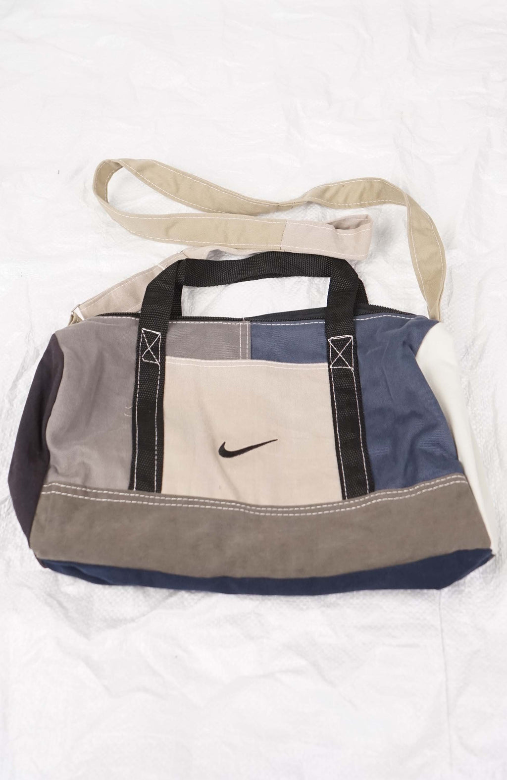 Multicolored bag with a Nike logo on a white background