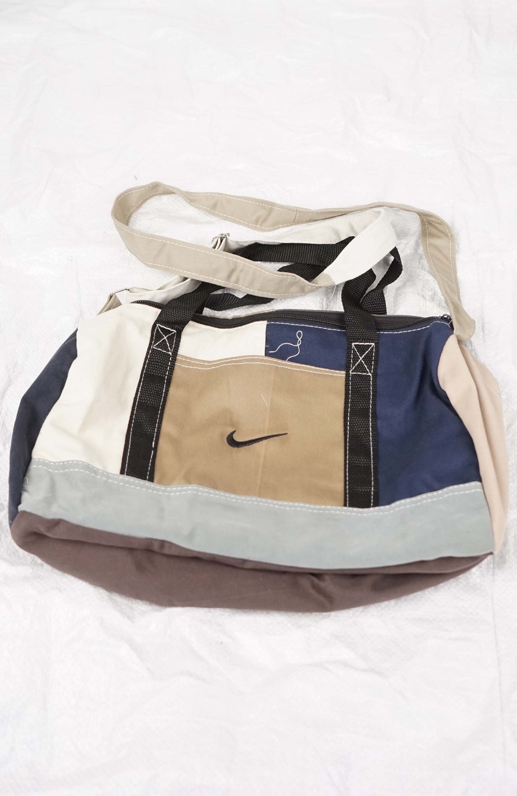 Multicolored bag with a Nike logo on a white background