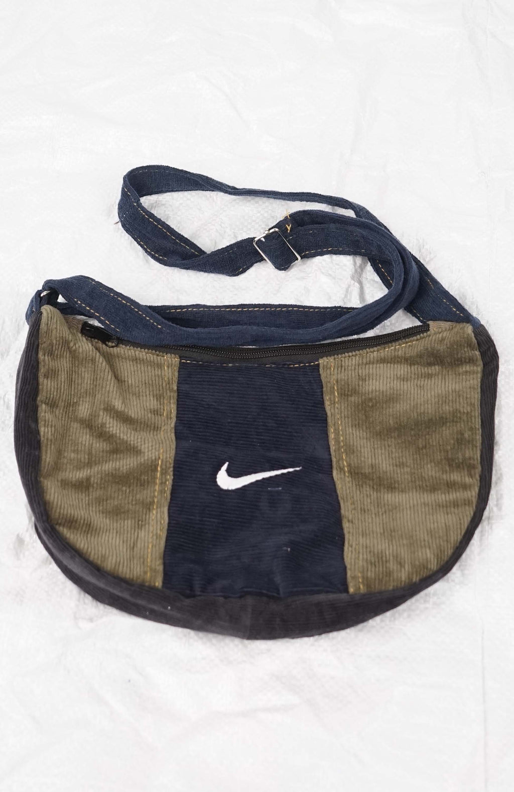 Nike bag with brown and navy design on a white background