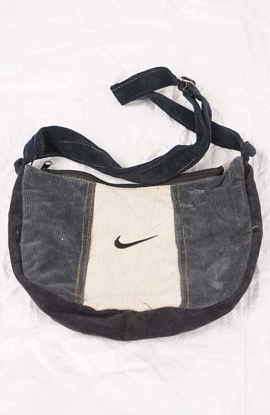 Nike bag with black strap on a white background