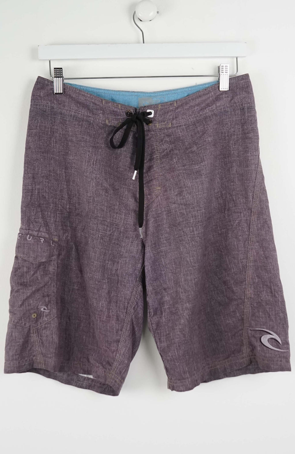Gray shorts with a black drawstring on a white background