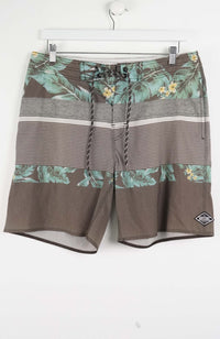 Brown shorts with floral patterns on a white background