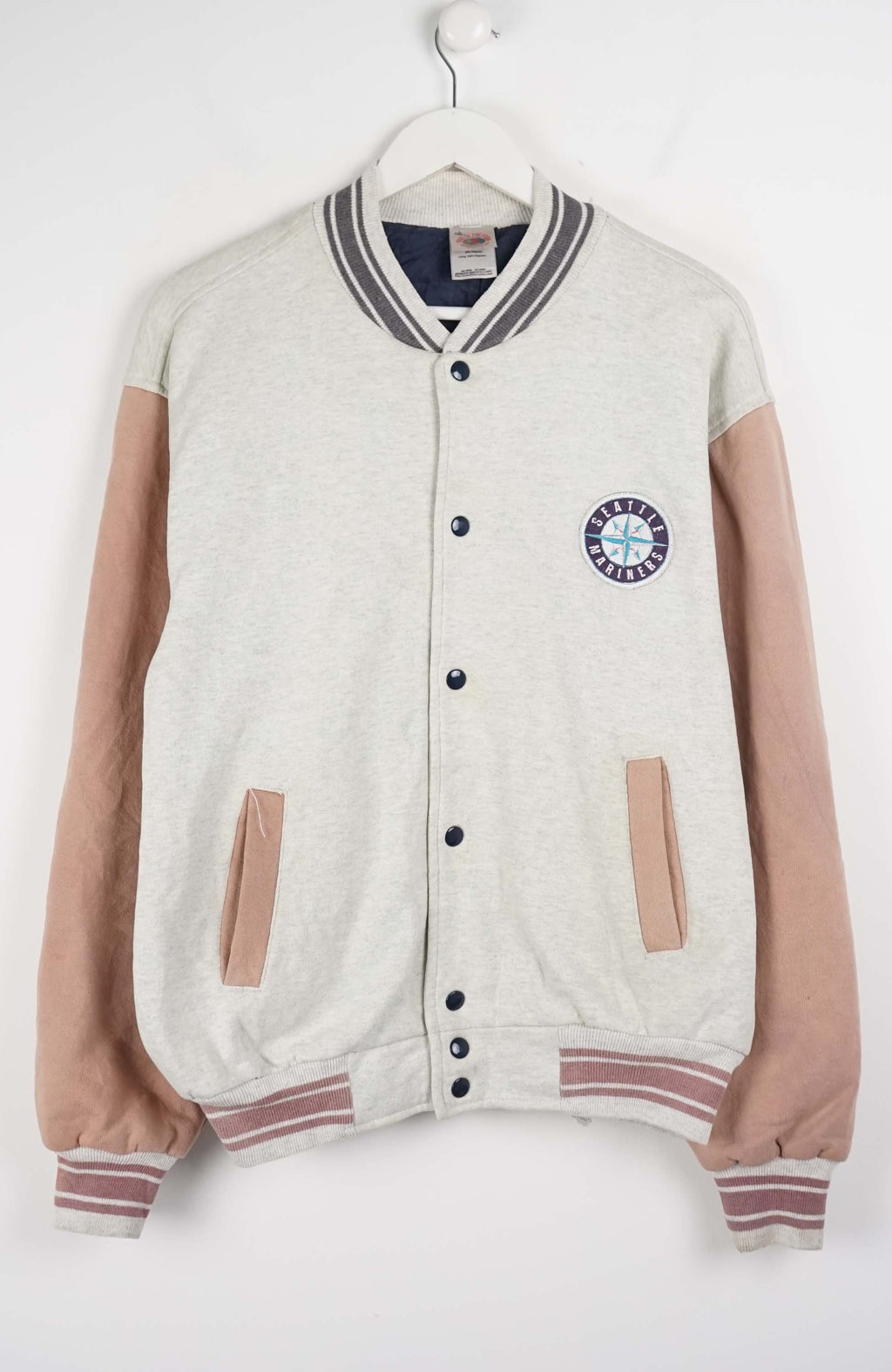 Varsity jacket with beige sleeves and a logo on a white background