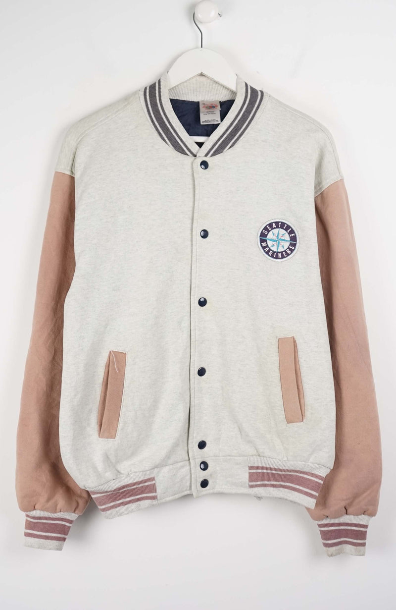Varsity jacket with beige sleeves and a logo on a white background