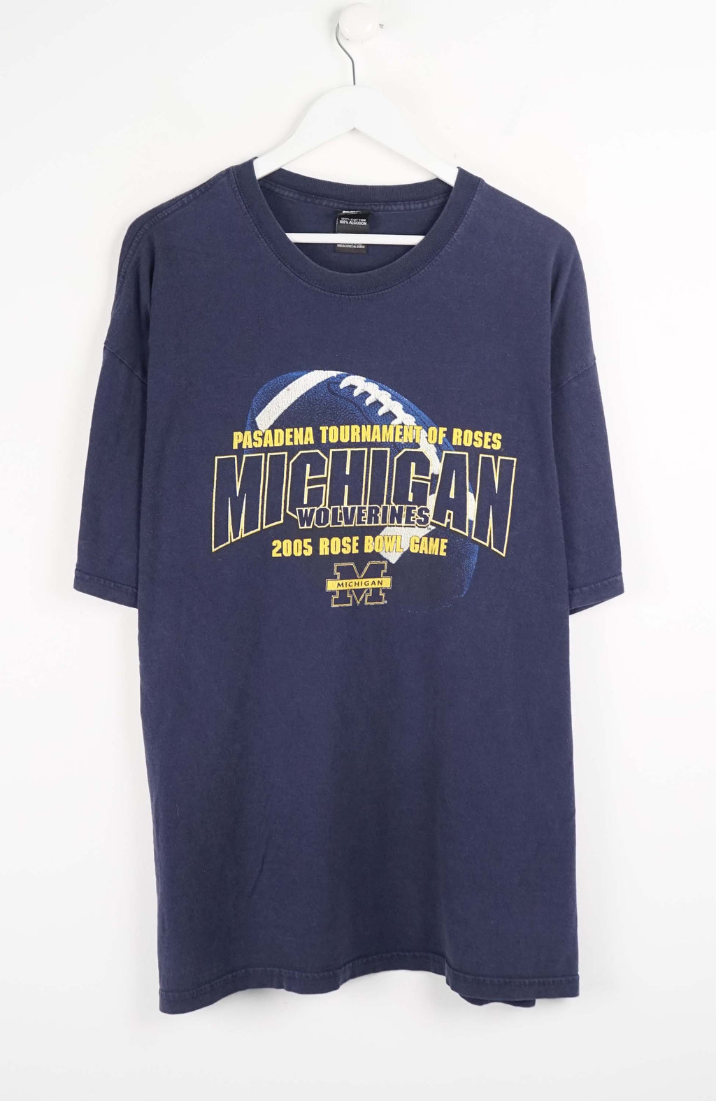 Navy blue t-shirt with Michigan Wolverines graphic on a white background
