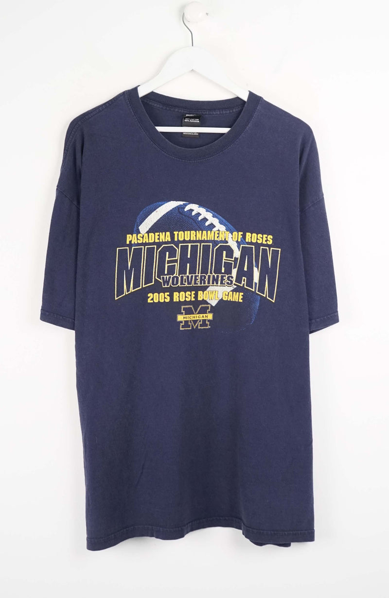 Navy blue t-shirt with Michigan Wolverines graphic on a white background