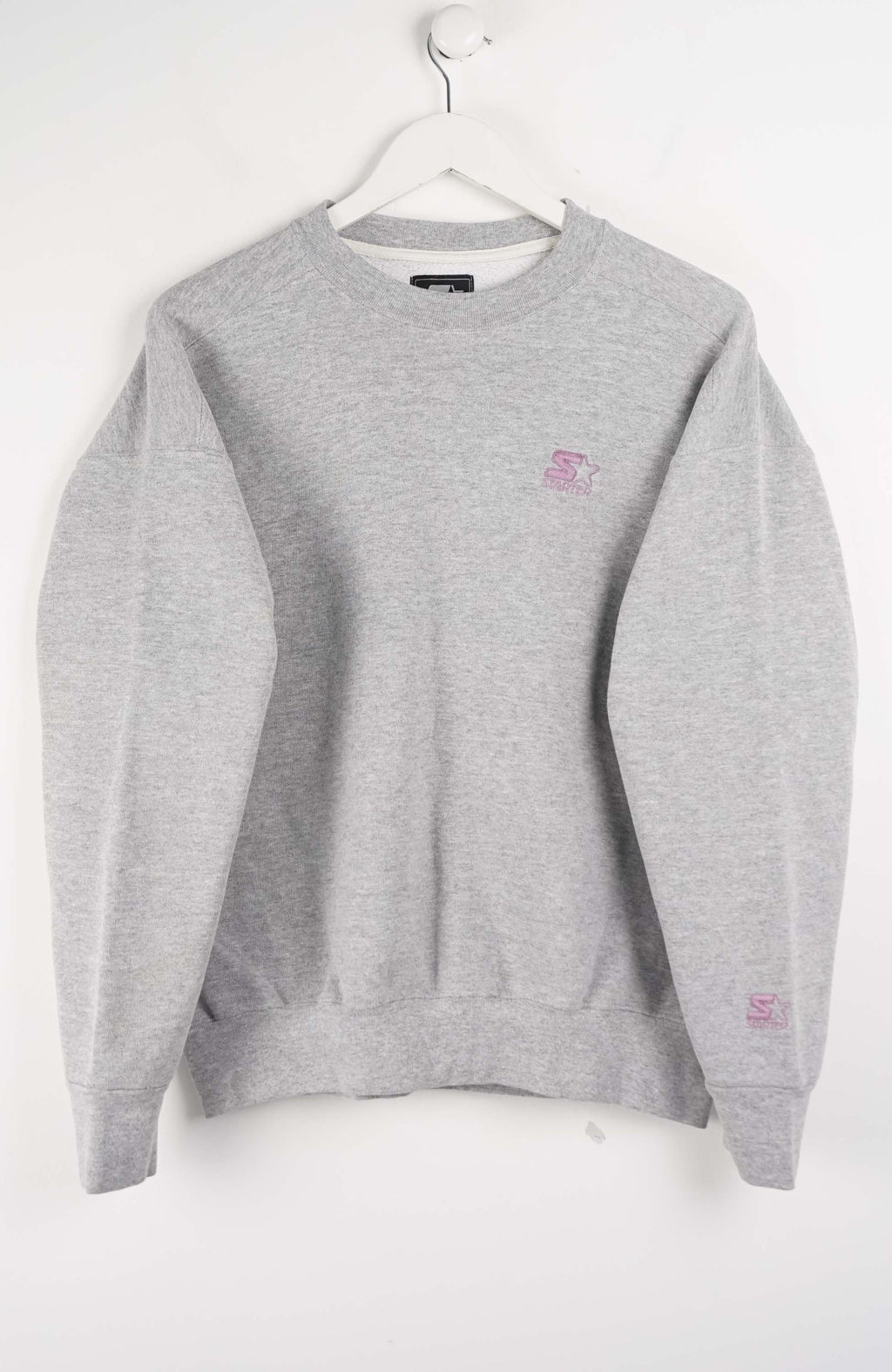 Gray sweatshirt with a small logo on a white background