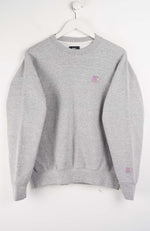 Gray sweatshirt with a small logo on a white background