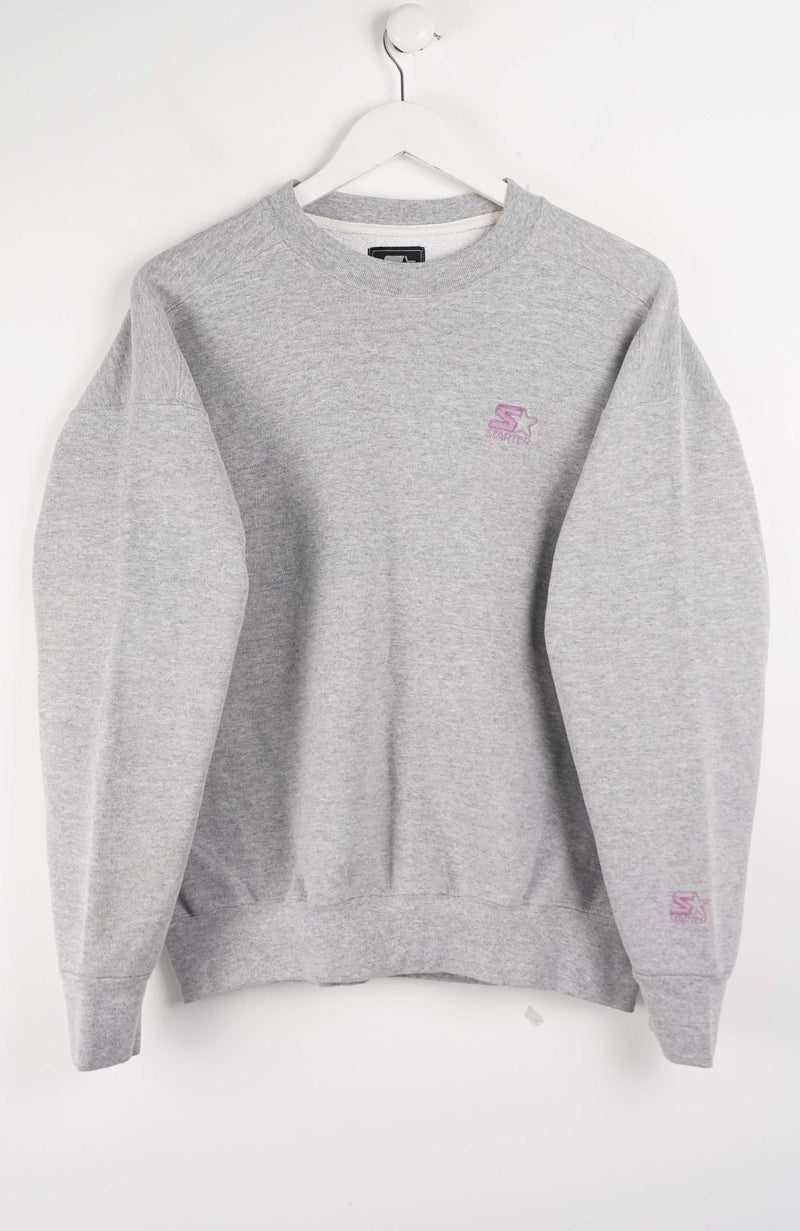 Gray sweatshirt with a small logo on a white background