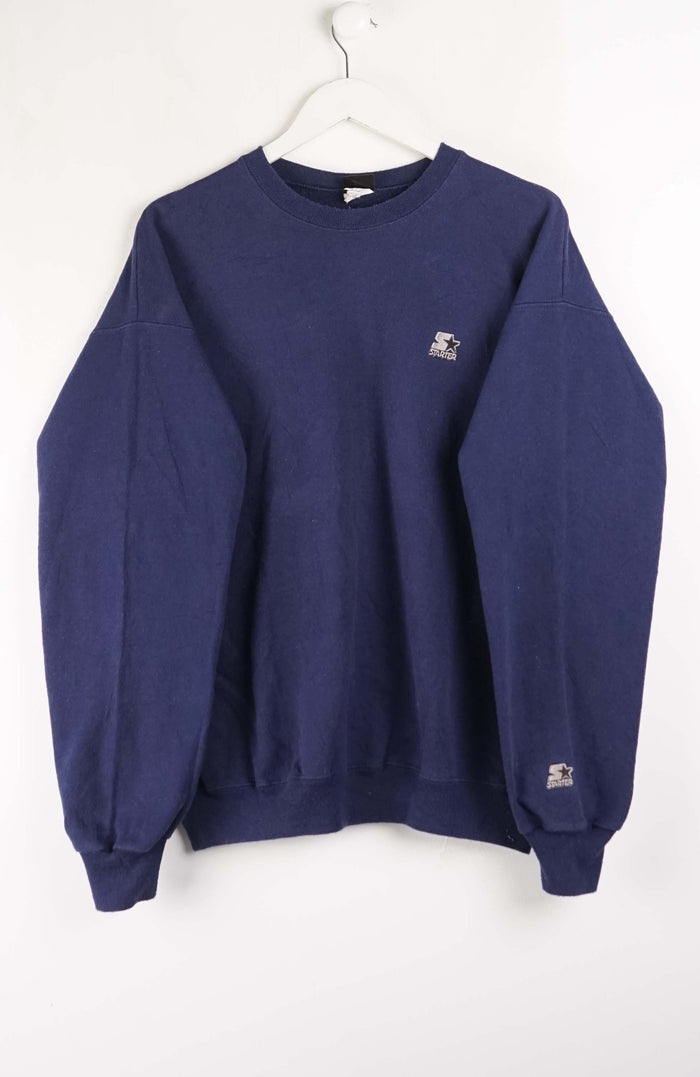 Navy blue sweatshirt with a small logo on a white background
