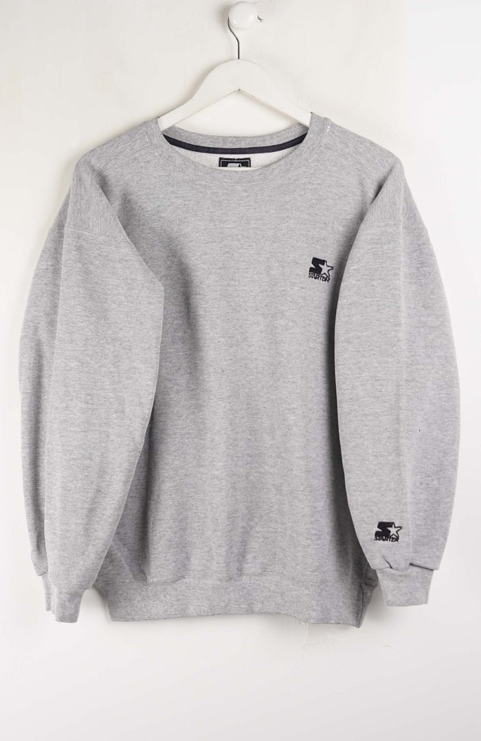 Gray sweatshirt with brand logos on a white background