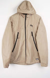 Beige jacket with black zippers on a white background