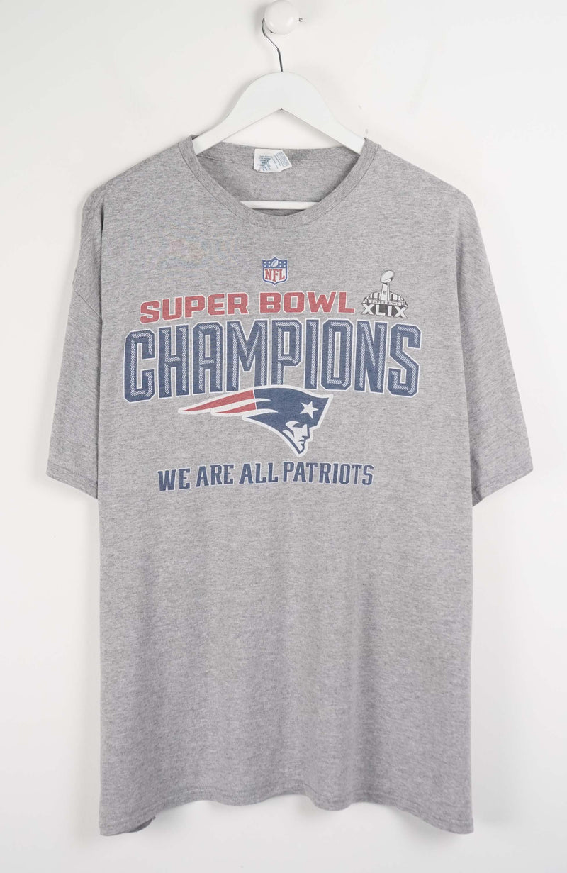 Gray t-shirt with Super Bowl Champions text and logo on a white background