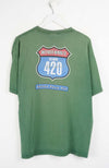 Green t-shirt with a logo on a white background